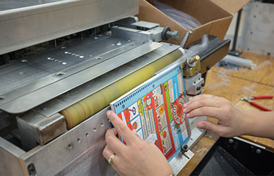 Person binding a brochure