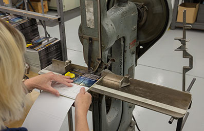 Person binding a brochure